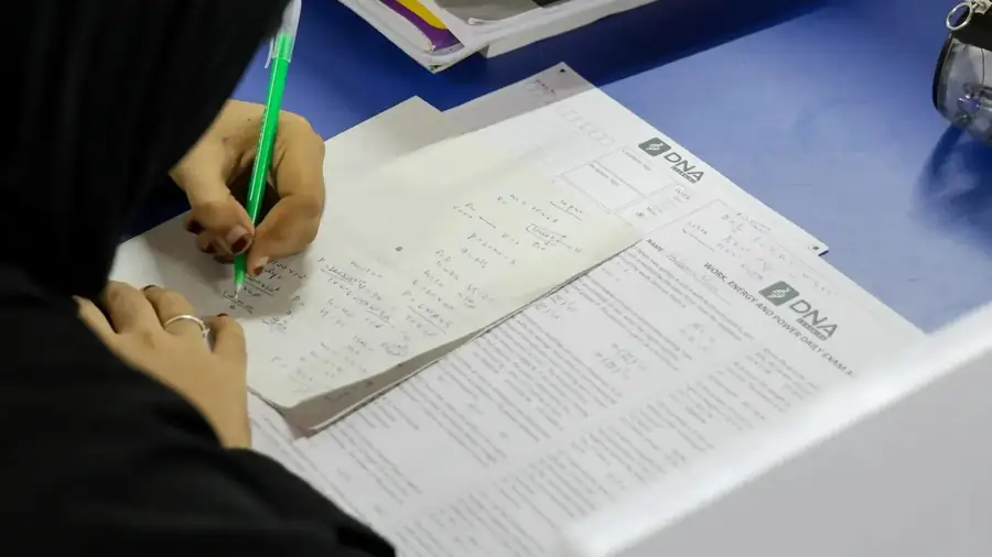 A student writing a DNA Learning practice test