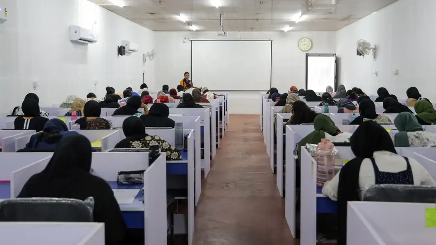 Students writing a test in a classroom